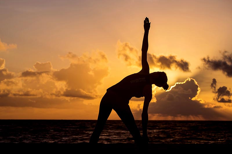 Yoga and stretching on the beach